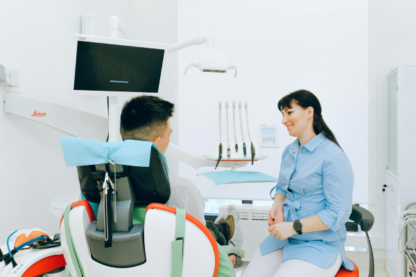 Dentist talking with a patient